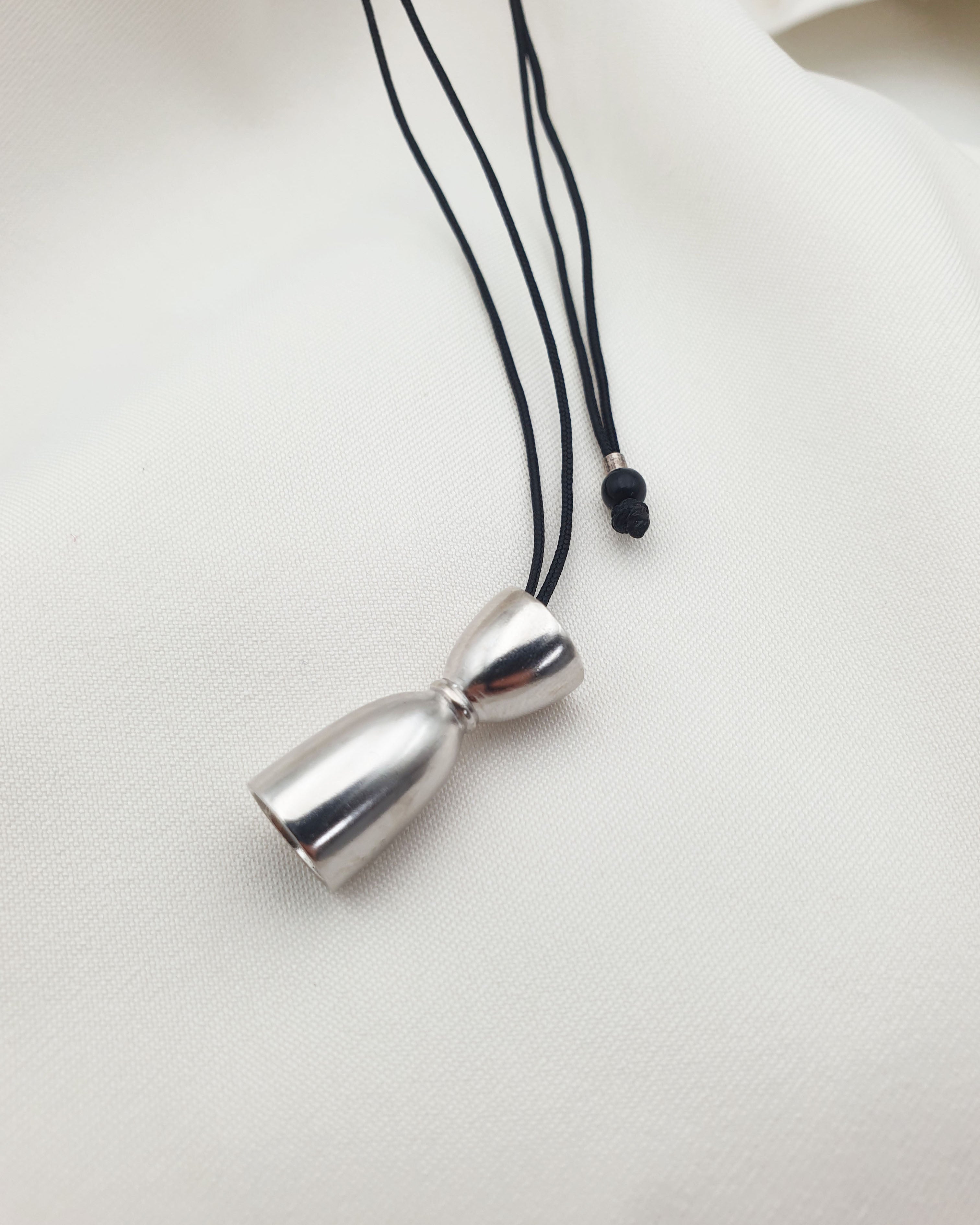 BELL JIGGER NECKLACE